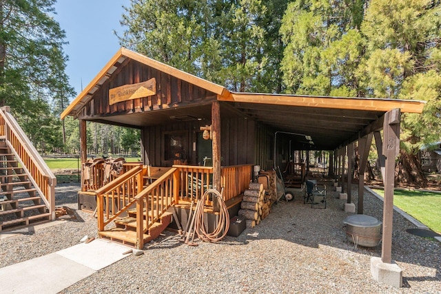 exterior space with a carport and stairs