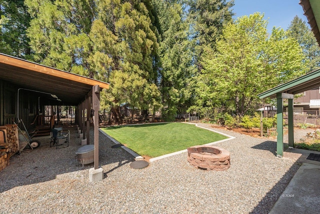 view of yard featuring a fire pit