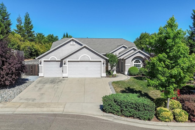 3641 Deuce Way, Redding, CA 96002 - ranch-style house featuring a garage, concrete driveway, and stucco siding