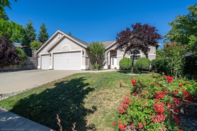 3641 Deuce Way, Redding, CA 96002 - single story home with a garage, stucco siding, a front yard, and driveway