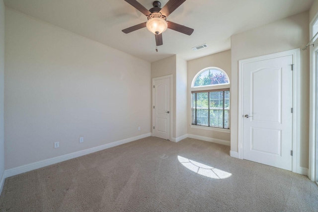 3641 Deuce Way, Redding, CA 96002 - empty room featuring light carpet, baseboards, and a ceiling fan