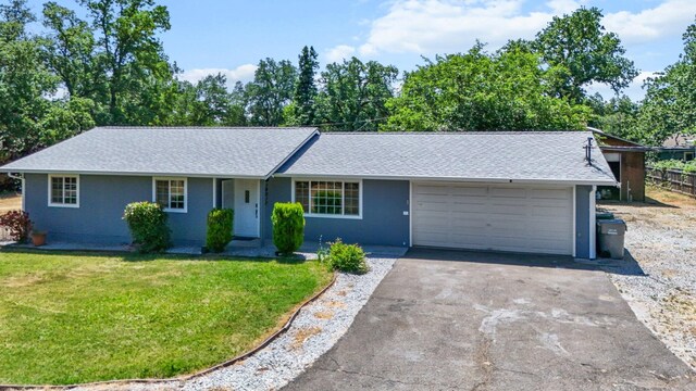 19017 Snowflake Ln, Redding, CA 96003 - single story home with asphalt driveway, an attached garage, a front lawn, and a shingled roof