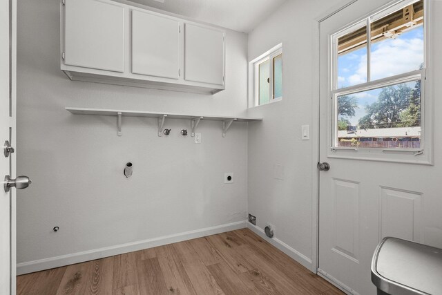 19017 Snowflake Ln, Redding, CA 96003 - laundry room featuring cabinet space, light wood-style flooring, baseboards, and electric dryer hookup