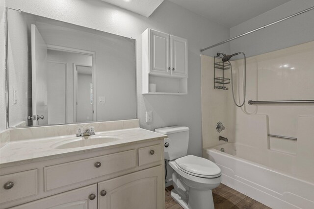 19017 Snowflake Ln, Redding, CA 96003 - bathroom featuring toilet,  shower combination, wood finished floors, and vanity