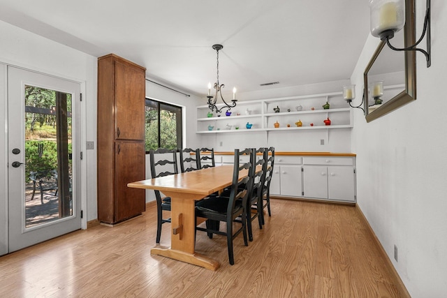 21030 Shangrila Dr, Red Bluff, CA 96080 - dining space with light wood-style flooring and a chandelier