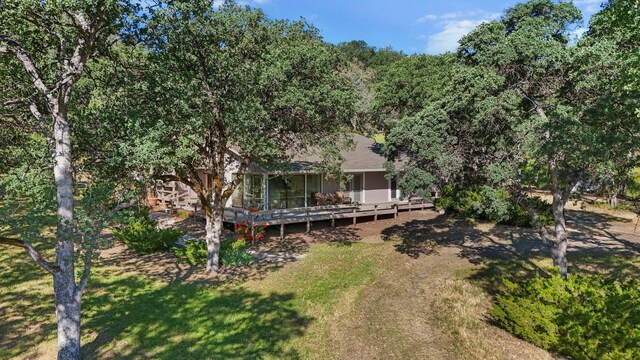 21030 Shangrila Dr, Red Bluff, CA 96080 - back of property featuring a deck and a yard