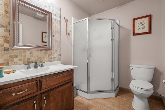 21030 Shangrila Dr, Red Bluff, CA 96080 - bathroom featuring toilet, vanity, a shower stall, and wood finished floors