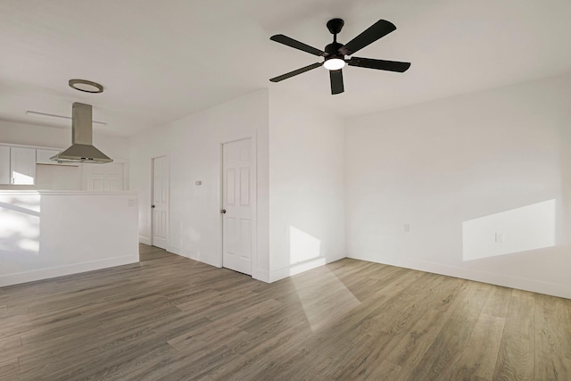 1048 Franklin St, Red Bluff, CA 96080 - unfurnished living room featuring baseboards, a ceiling fan, and wood finished floors