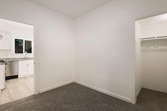 1048 Franklin St, Red Bluff, CA 96080 - interior space featuring baseboards, light carpet, and a sink