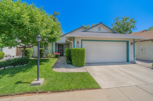 427 Yolla Bolly Trl, Redding, CA 96003 - single story home with an attached garage, a front yard, and concrete driveway