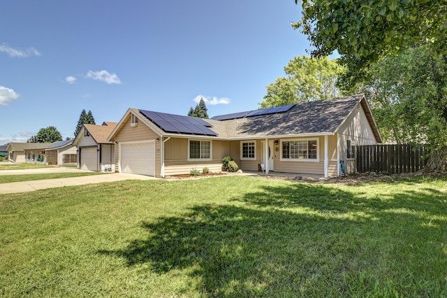 3268 Lyndsey Ln, Anderson, CA 96007 - ranch-style house with an attached garage, solar panels, and concrete driveway