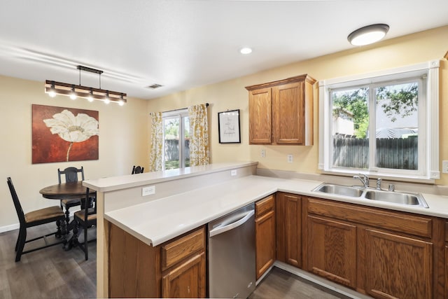 3268 Lyndsey Ln, Anderson, CA 96007 - kitchen featuring dishwasher, a sink, a peninsula, dark wood-type flooring, and brown cabinets