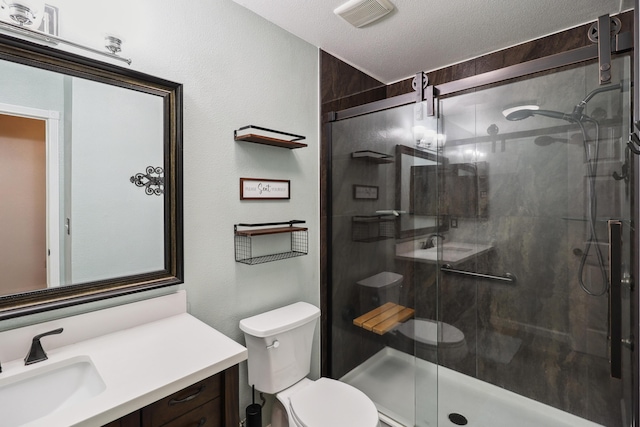 3268 Lyndsey Ln, Anderson, CA 96007 - full bathroom featuring toilet, vanity, a shower stall, and a textured ceiling