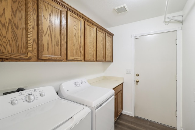 3268 Lyndsey Ln, Anderson, CA 96007 - laundry room with washer and clothes dryer, cabinet space, and dark wood finished floors