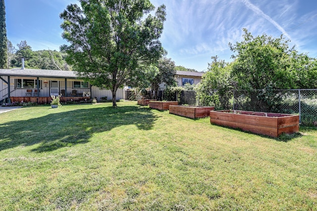 14851 Ravine Rd, Redding, CA 96003 - view of yard with a vegetable garden and covered porch