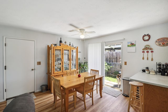 14851 Ravine Rd, Redding, CA 96003 - dining area featuring a ceiling fan and light wood-type flooring