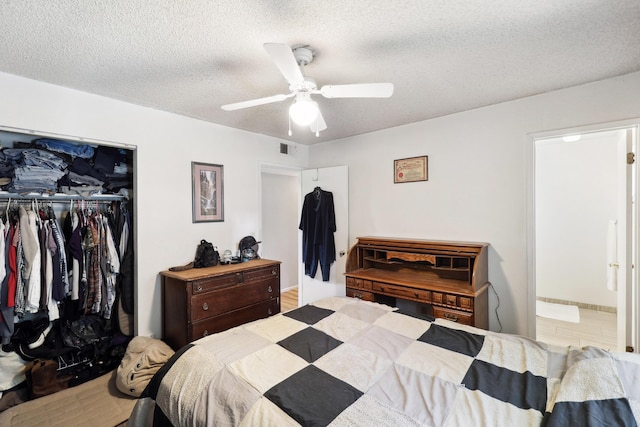 14851 Ravine Rd, Redding, CA 96003 - bedroom featuring a closet, a textured ceiling, ceiling fan, and ensuite bathroom