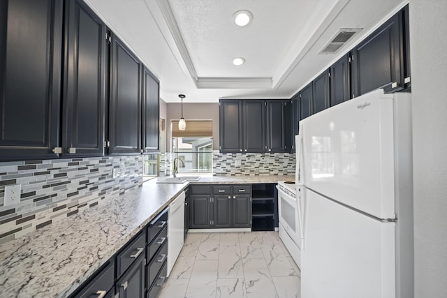 426 Ridgecrest Trl Unit 223, Redding, CA 96003 - kitchen with white appliances, a raised ceiling, light marble finish flooring, tasteful backsplash, and recessed lighting