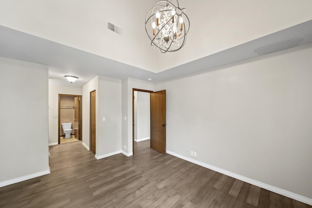426 Ridgecrest Trl Unit 223, Redding, CA 96003 - empty room featuring wood finished floors, a chandelier, and a towering ceiling