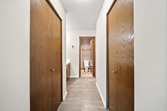 426 Ridgecrest Trl Unit 223, Redding, CA 96003 - hallway with light wood-style floors and baseboards