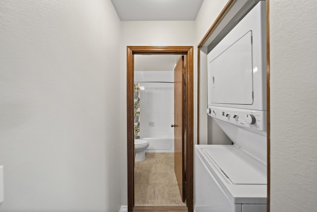426 Ridgecrest Trl Unit 223, Redding, CA 96003 - laundry area featuring estacked washer and dryer and stone finish floors