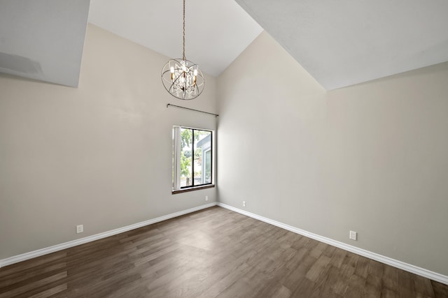 426 Ridgecrest Trl Unit 223, Redding, CA 96003 - unfurnished room featuring a chandelier, dark wood-style floors, and high vaulted ceiling