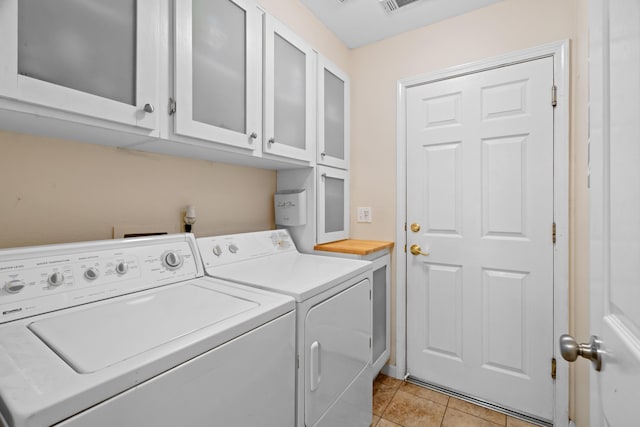 1946 Jeanae Ct, Redding, CA 96002 - laundry area with cabinet space, independent washer and dryer, and light tile patterned floors