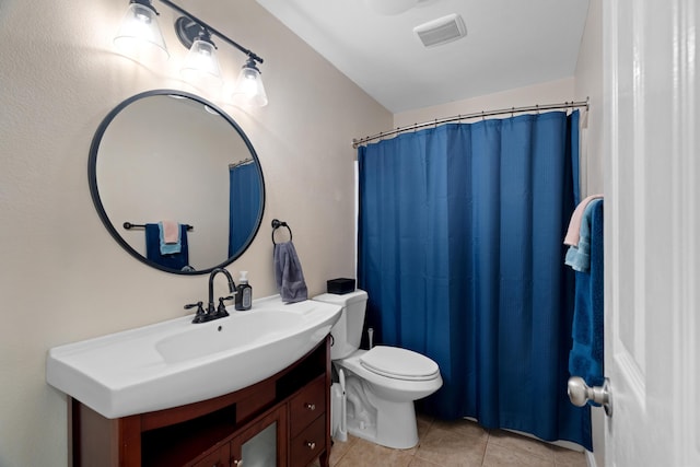 1946 Jeanae Ct, Redding, CA 96002 - full bath featuring tile patterned floors, vanity, toilet, and a shower with shower curtain