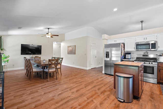 1946 Jeanae Ct, Redding, CA 96002 - kitchen featuring appliances with stainless steel finishes, wood counters, a ceiling fan, light wood-style flooring, and lofted ceiling