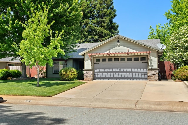 1946 Jeanae Ct, Redding, CA 96002 - view of front of home featuring stone siding, an attached garage, driveway, and roof with shingles