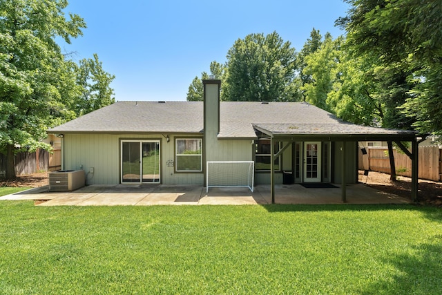 1946 Jeanae Ct, Redding, CA 96002 - rear view of house featuring a patio area, central AC, a chimney, and roof with shingles