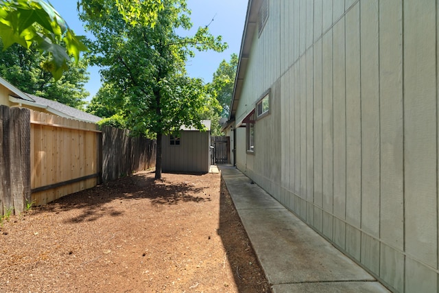 1946 Jeanae Ct, Redding, CA 96002 - view of property exterior featuring a fenced backyard, an outbuilding, and a storage unit