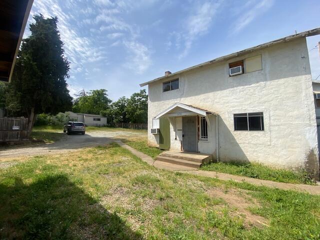 1170-1176 Orange Ave, Redding, CA 96001 - view of front facade with stucco siding and a front lawn