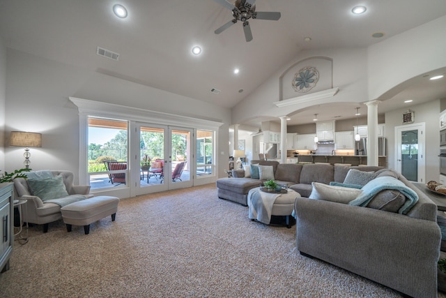 living area featuring decorative columns, high vaulted ceiling, a ceiling fan, carpet flooring, and recessed lighting