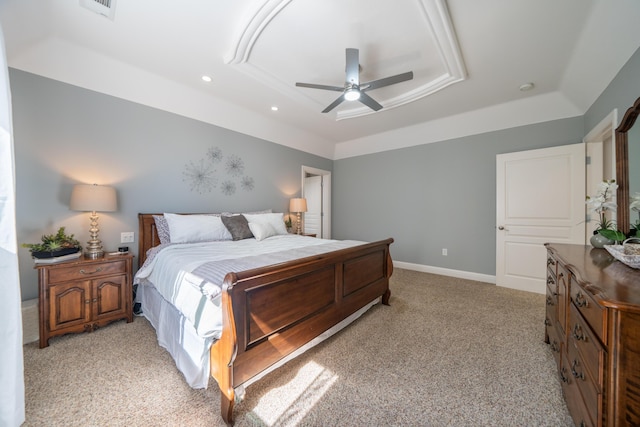 bedroom featuring a tray ceiling, recessed lighting, light colored carpet, and ceiling fan
