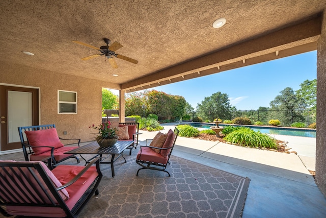 view of patio featuring an outdoor living space, ceiling fan, and an outdoor pool