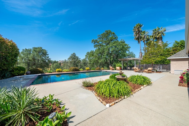 view of pool with a patio, fence, and a pergola