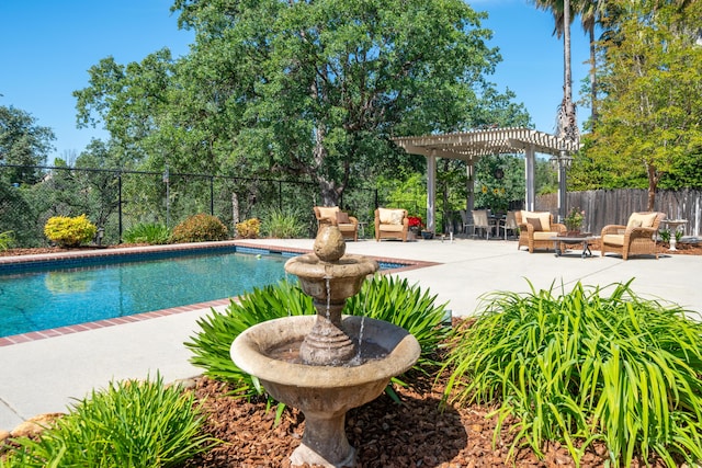 view of pool with a pergola, fence, and a patio
