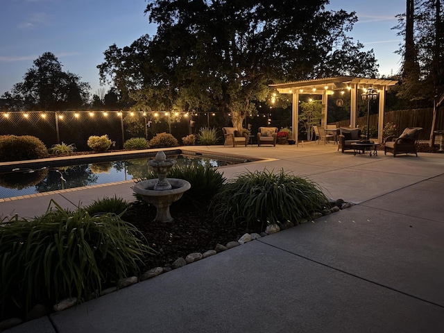 view of swimming pool with an outdoor living space, a patio, and fence