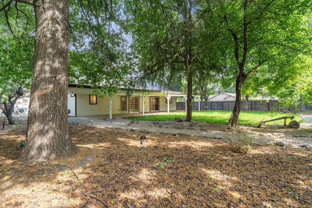 view of yard featuring fence and a patio area