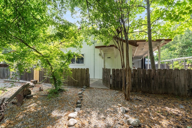 back of property with fence