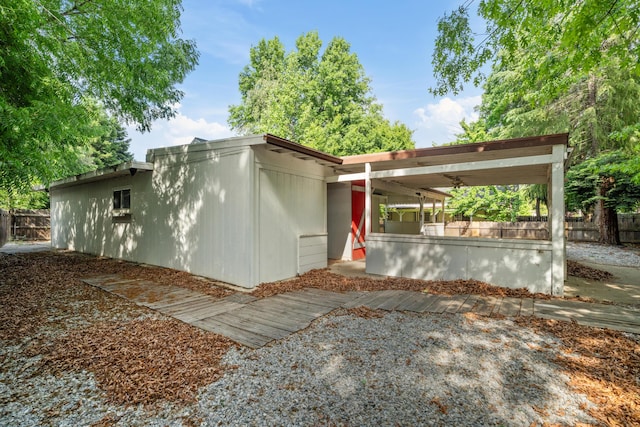 view of side of home with fence