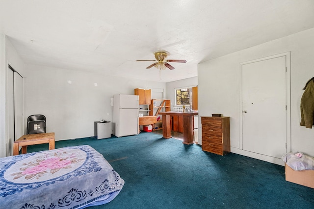 8686 Bell Springs Rd, Garberville, CA 95542 - bedroom featuring freestanding refrigerator, dark carpet, and ceiling fan
