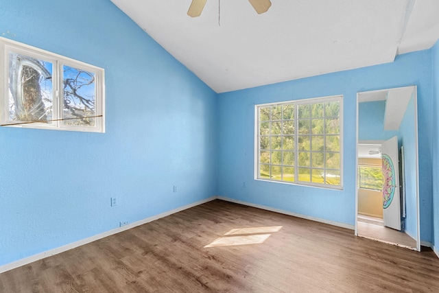 8686 Bell Springs Rd, Garberville, CA 95542 - unfurnished bedroom featuring lofted ceiling, wood finished floors, baseboards, and ceiling fan