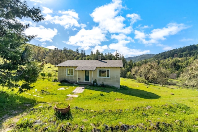 8686 Bell Springs Rd, Garberville, CA 95542 - view of front facade featuring a front lawn and a forest view