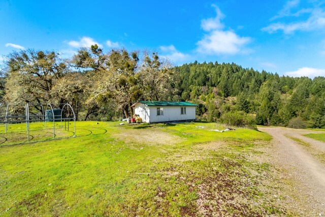 8686 Bell Springs Rd, Garberville, CA 95542 - view of grassy yard with a view of trees