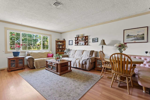 2350 Christian Ave, Redding, CA 96002 - living room featuring a textured ceiling, light wood-style floors, and ornamental molding