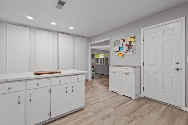 2350 Christian Ave, Redding, CA 96002 - kitchen featuring light wood-style flooring, white cabinets, and recessed lighting