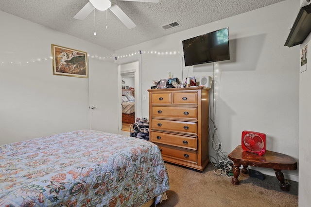 2350 Christian Ave, Redding, CA 96002 - bedroom with light carpet, a textured ceiling, and ceiling fan
