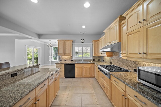 831 Santa Cruz Dr, Redding, CA 96003 - kitchen with appliances with stainless steel finishes, under cabinet range hood, light brown cabinets, backsplash, and a sink